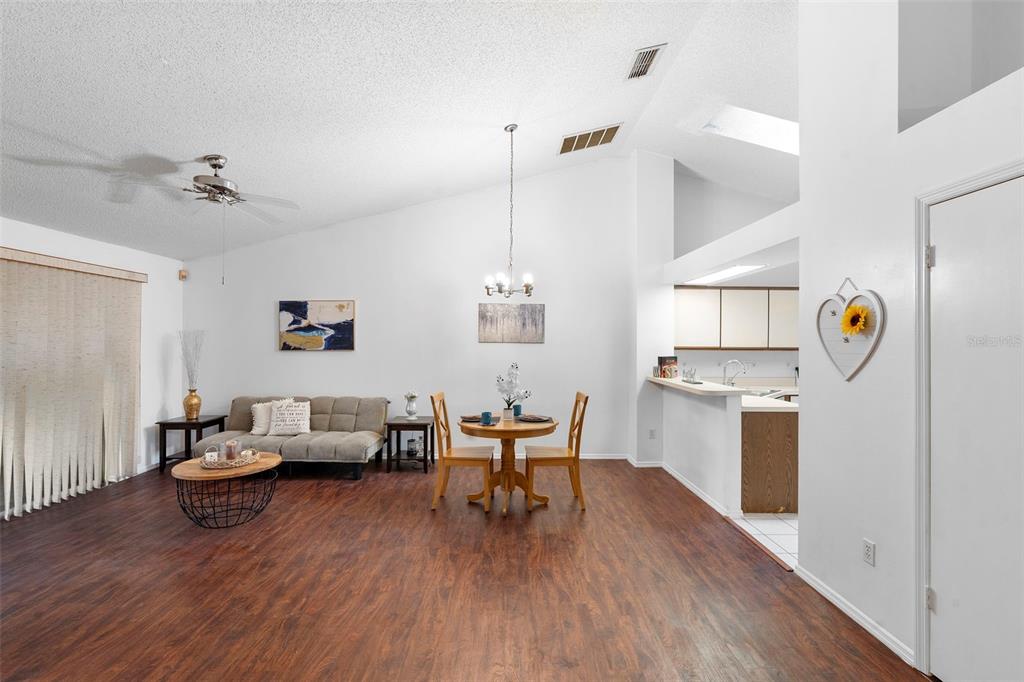 13103 Edberg Court Orlando, FL 32824 - Photo 17 of 42 a living room with furniture and a wooden floor