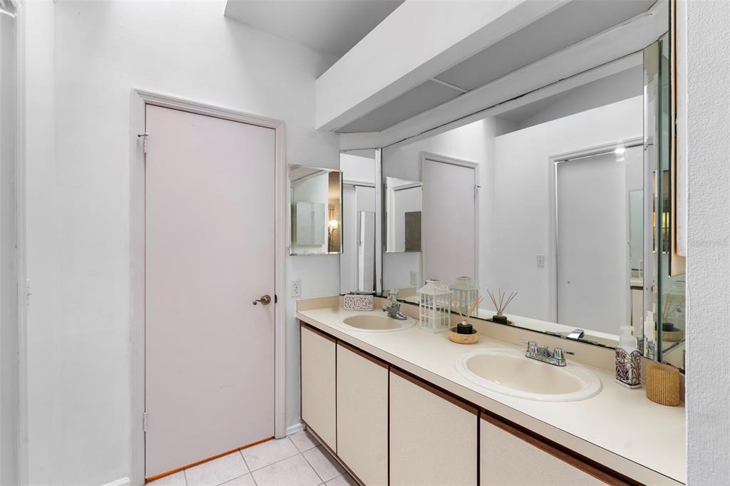 13103 Edberg Court Orlando, FL 32824 - Photo 29 of 42 a bathroom with a sink and a mirror