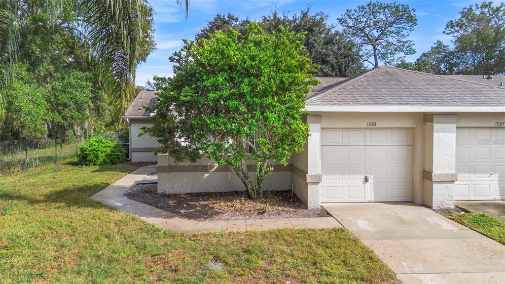 13103 Edberg Court Orlando, FL 32824 - Photo 3 of 42 a view of a house with a yard