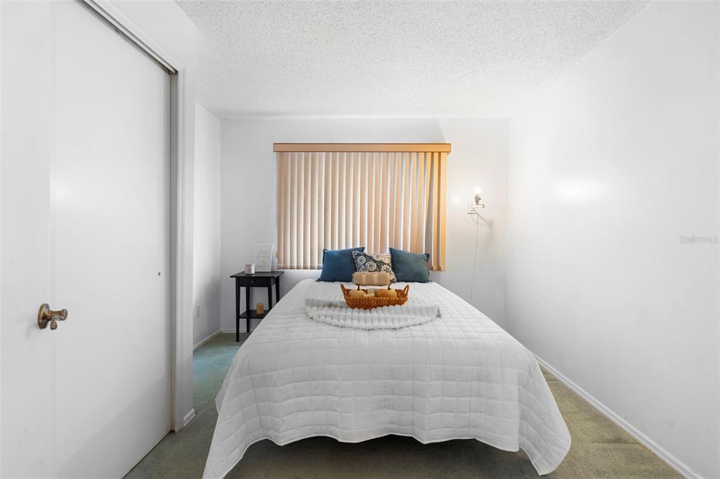 13103 Edberg Court Orlando, FL 32824 - Photo 32 of 42 a bedroom with a bed and window