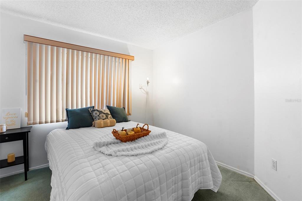 13103 Edberg Court Orlando, FL 32824 - Photo 33 of 42 a bedroom with a bed and a window