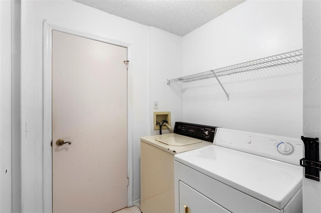 13103 Edberg Court Orlando, FL 32824 - Photo 35 of 42 a utility room with dryer and washer