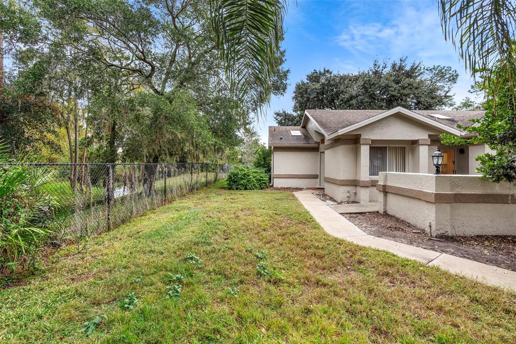 13103 Edberg Court Orlando, FL 32824 - Photo 4 of 42 a front view of a house with a yard