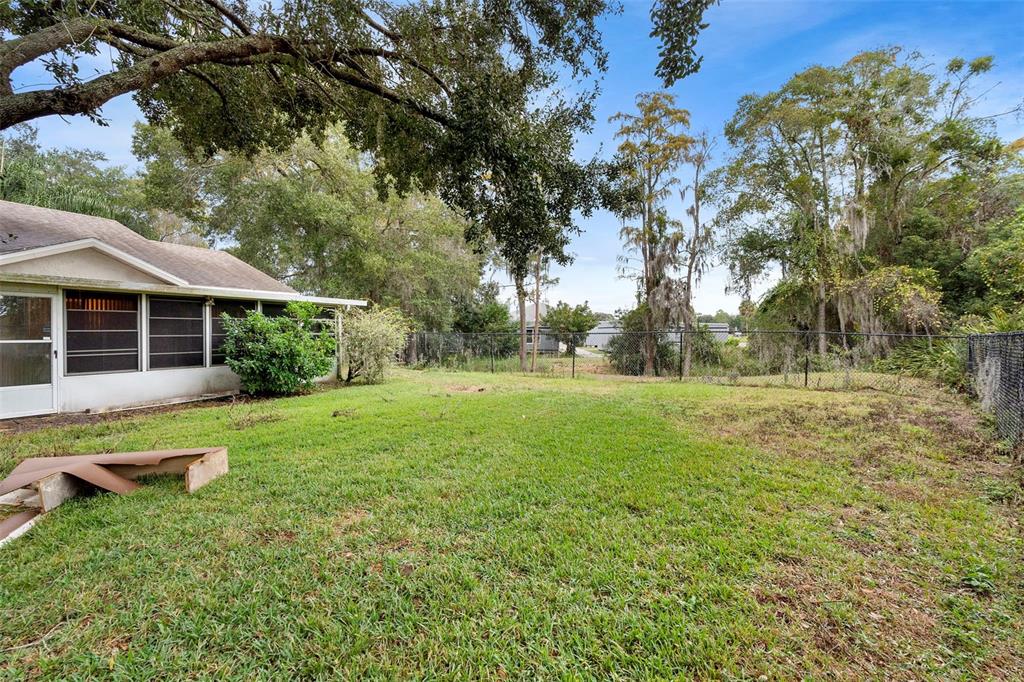 13103 Edberg Court Orlando, FL 32824 - Photo 5 of 42 a view of a house with a backyard