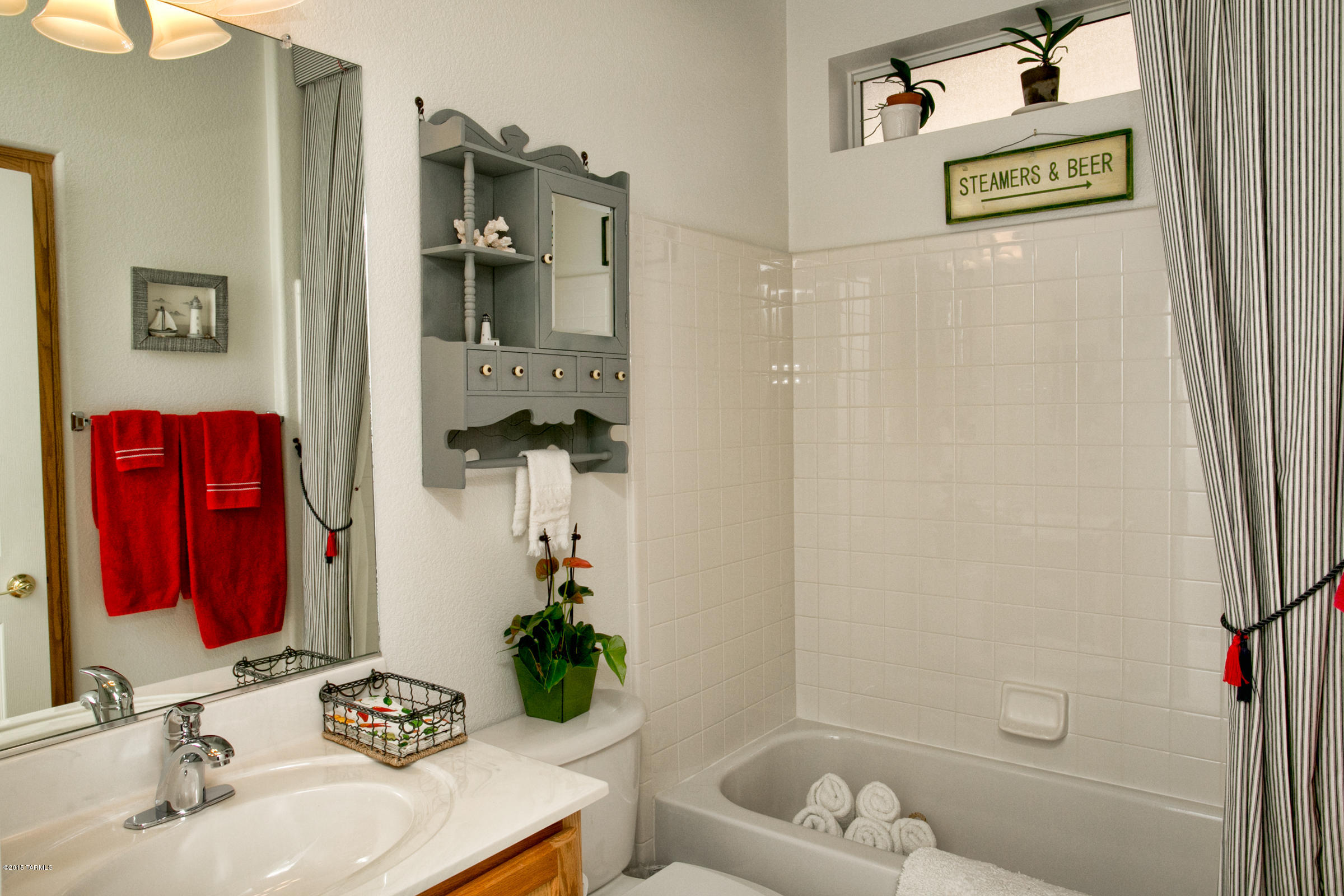 62419 East Northwood Road Tucson, AZ 85739 - Photo 24 of 30 a bathroom with a sink and a mirror