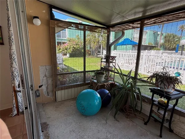 a view of a garden with wooden fence