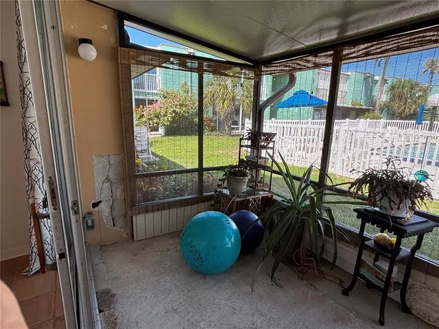 a view of a garden with wooden fence