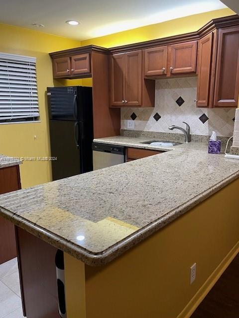 2960 Riverside Drive, Unit 3192 Coral Springs, FL 33065 - Photo 3 of 12 a kitchen with kitchen island a sink a stove and refrigerator