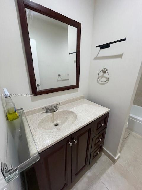 2960 Riverside Drive, Unit 3192 Coral Springs, FL 33065 - Photo 7 of 12 a bathroom with a sink and a mirror