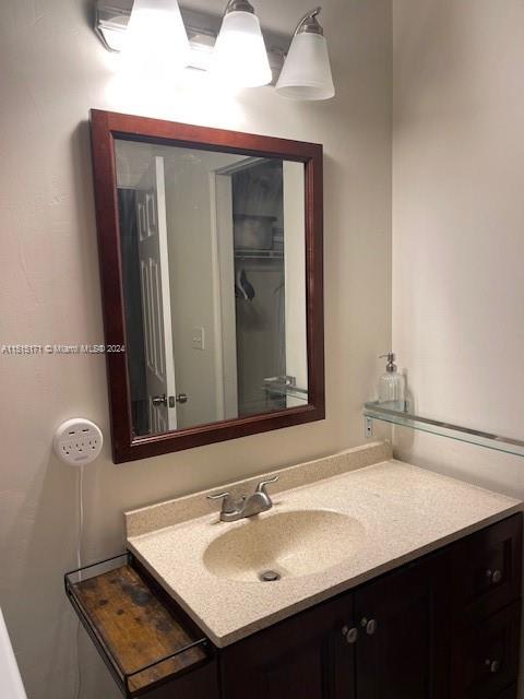 2960 Riverside Drive, Unit 3192 Coral Springs, FL 33065 - Photo 8 of 12 a bathroom with a sink and a mirror