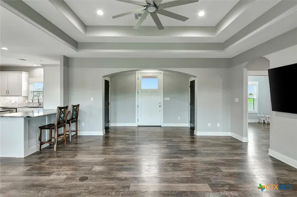 a view of a livingroom with furniture and a flat screen tv