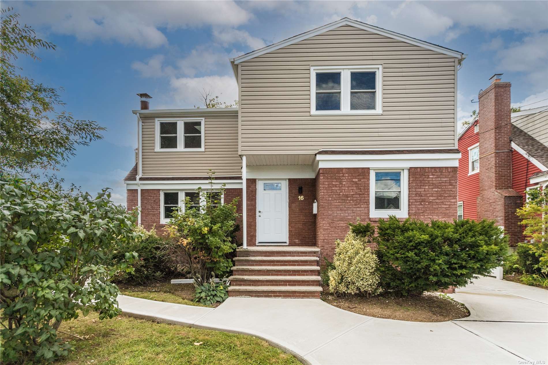 16 Babylon Road Merrick, NY 11566 - Photo 1 of 1 a front view of a house with a yard