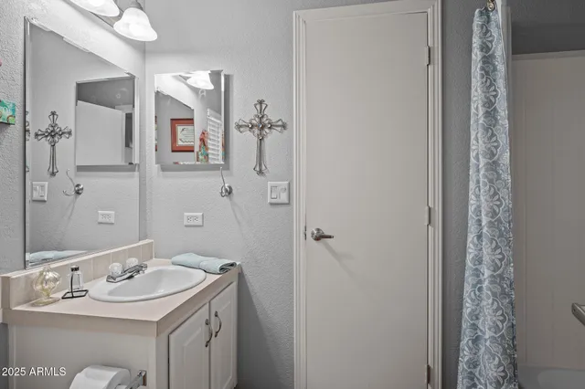 a bathroom with a sink and a mirror