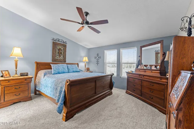 a bedroom with a bed and a dresser