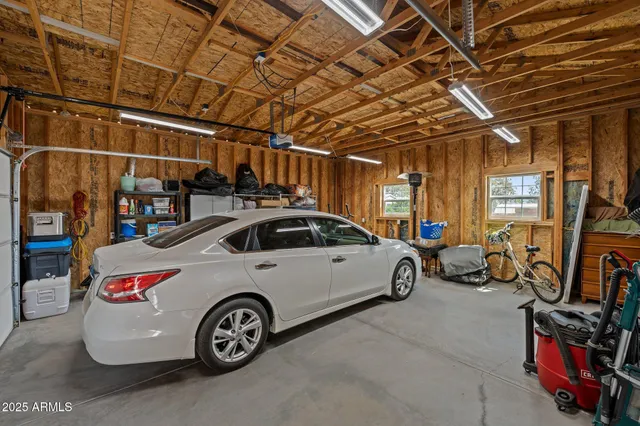 a view of parking garage with cars parked