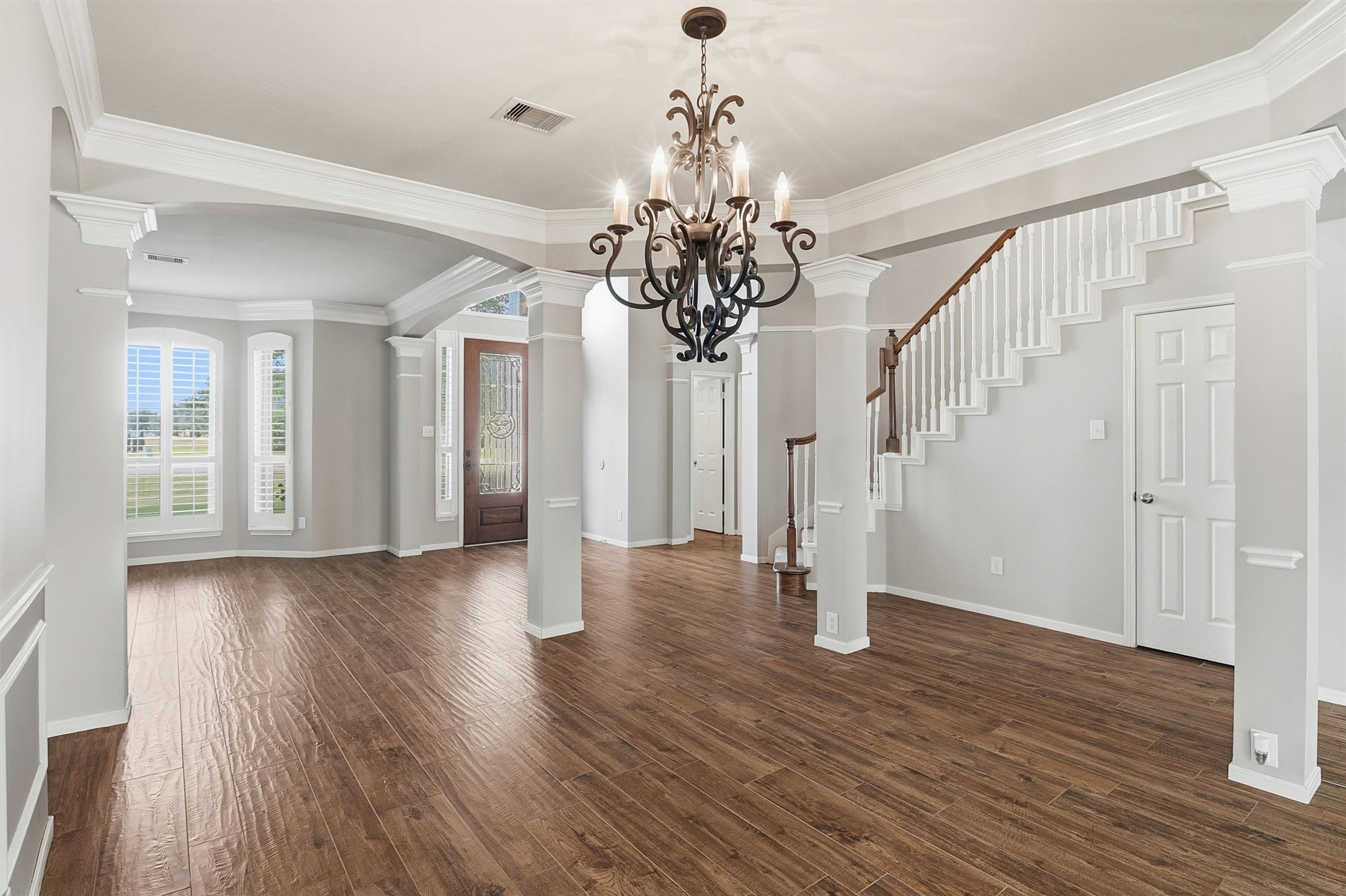 3602 River Bend Drive Rosenberg, TX 77471 - Photo 16 of 49 a view of a hallway with wooden floor and staircase