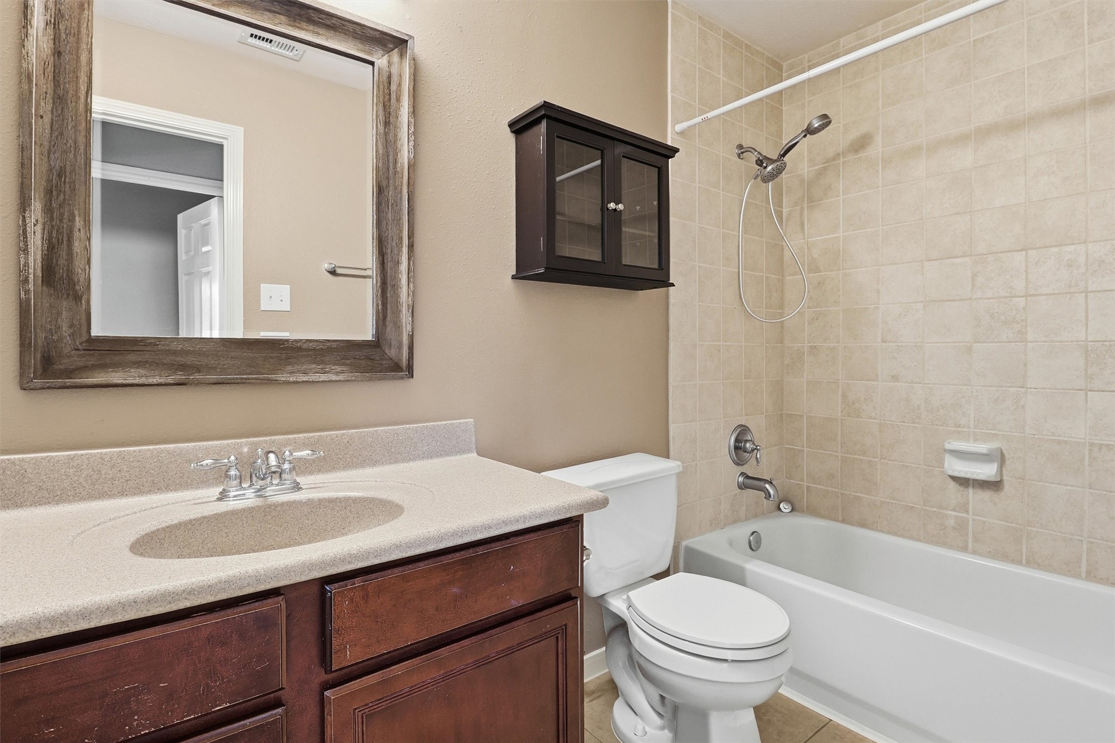 3602 River Bend Drive Rosenberg, TX 77471 - Photo 40 of 49 a bathroom with a sink toilet a mirror and shower
