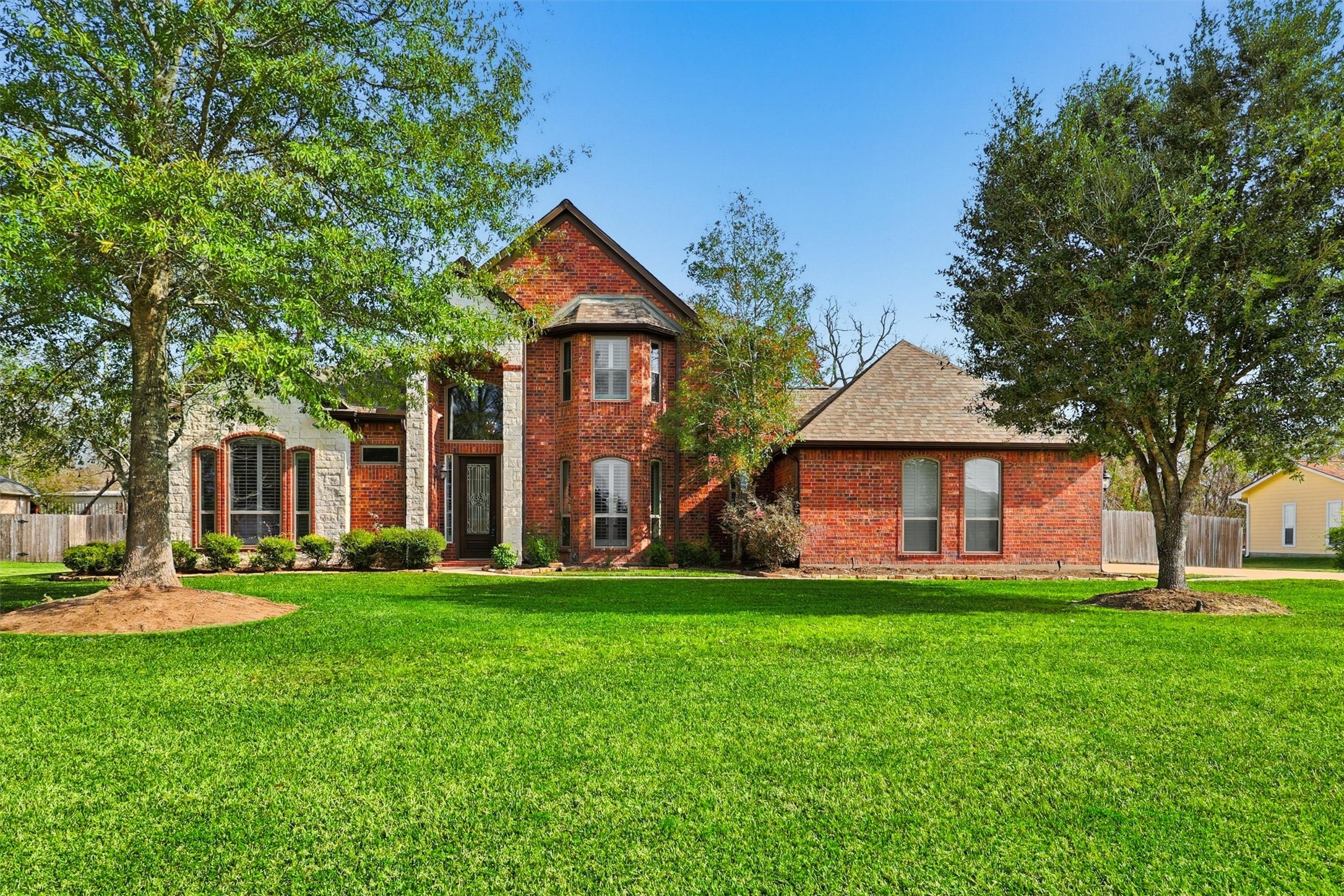 3602 River Bend Drive Rosenberg, TX 77471 - Photo 6 of 49 a front view of a house with a yard