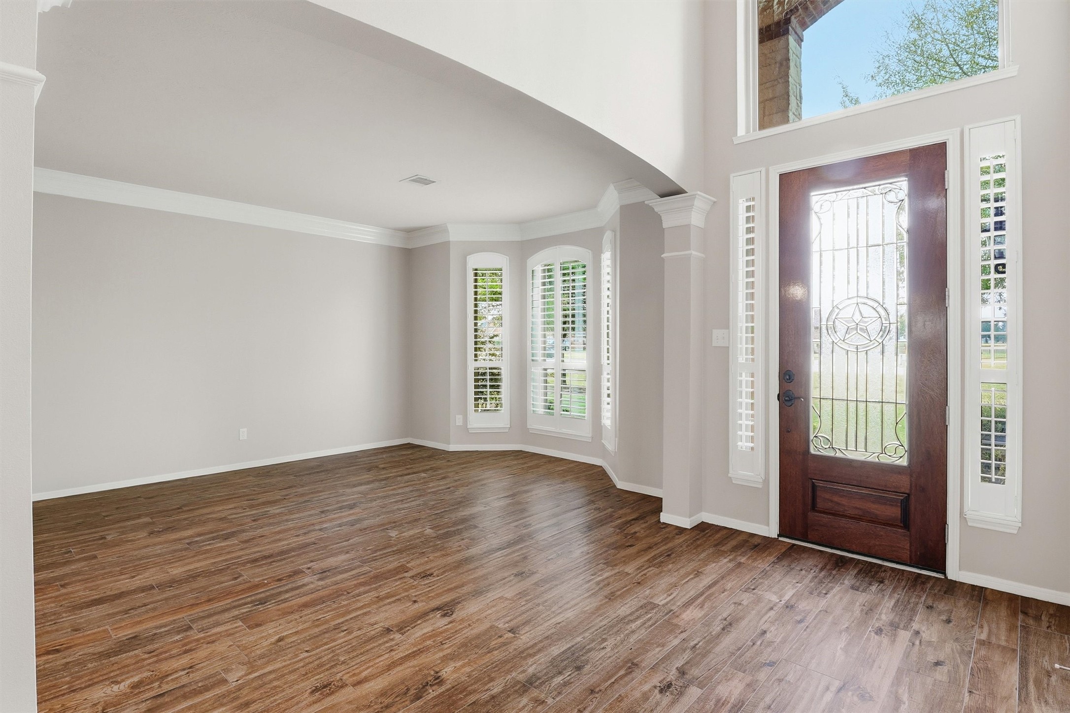 3602 River Bend Drive Rosenberg, TX 77471 - Photo 9 of 49 an empty room with wooden floor and windows