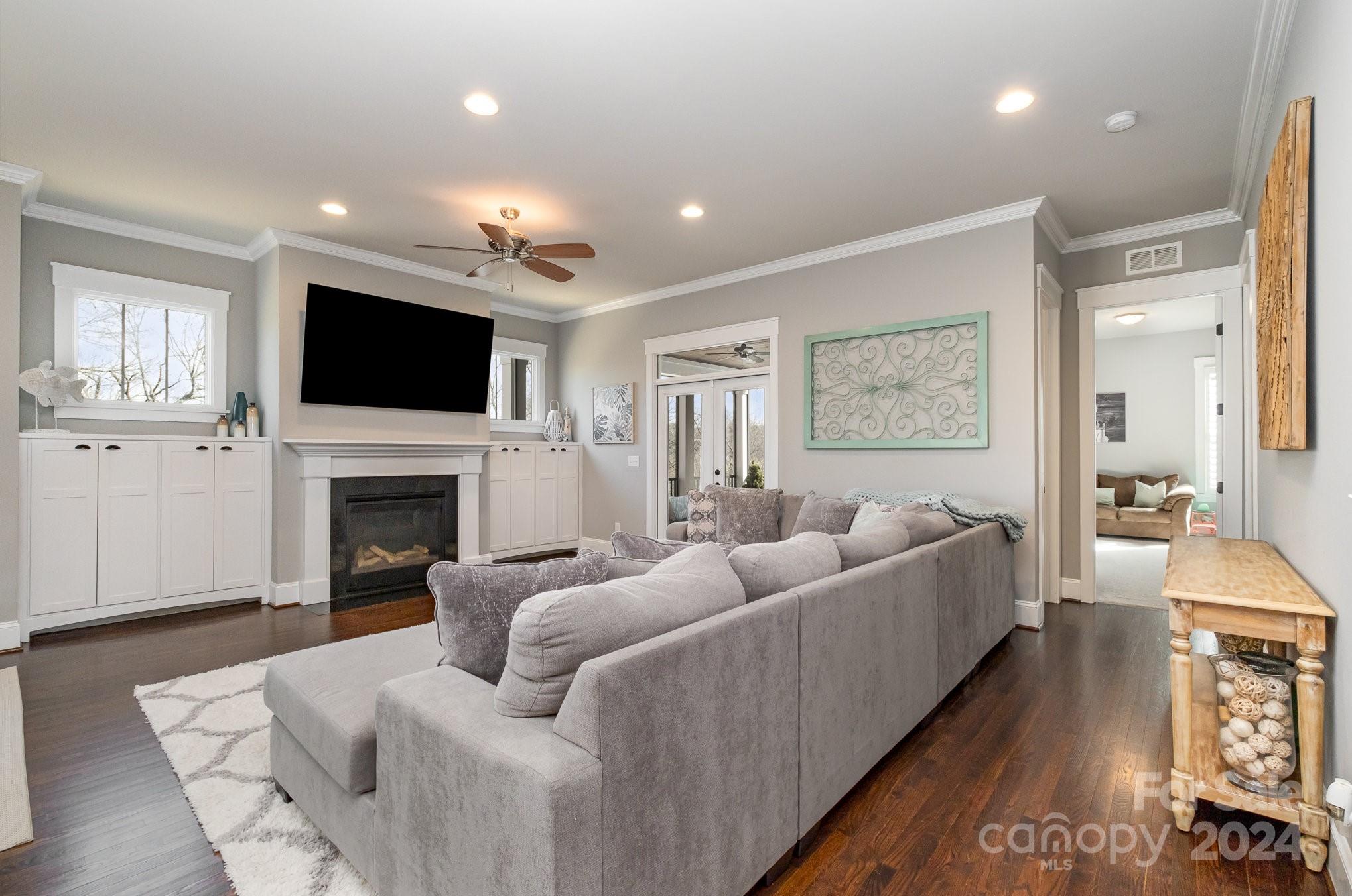 2289 Tatton Hall Road Fort Mill, SC 29715 - Photo 12 of 48 a living room with furniture a fireplace and a flat screen tv