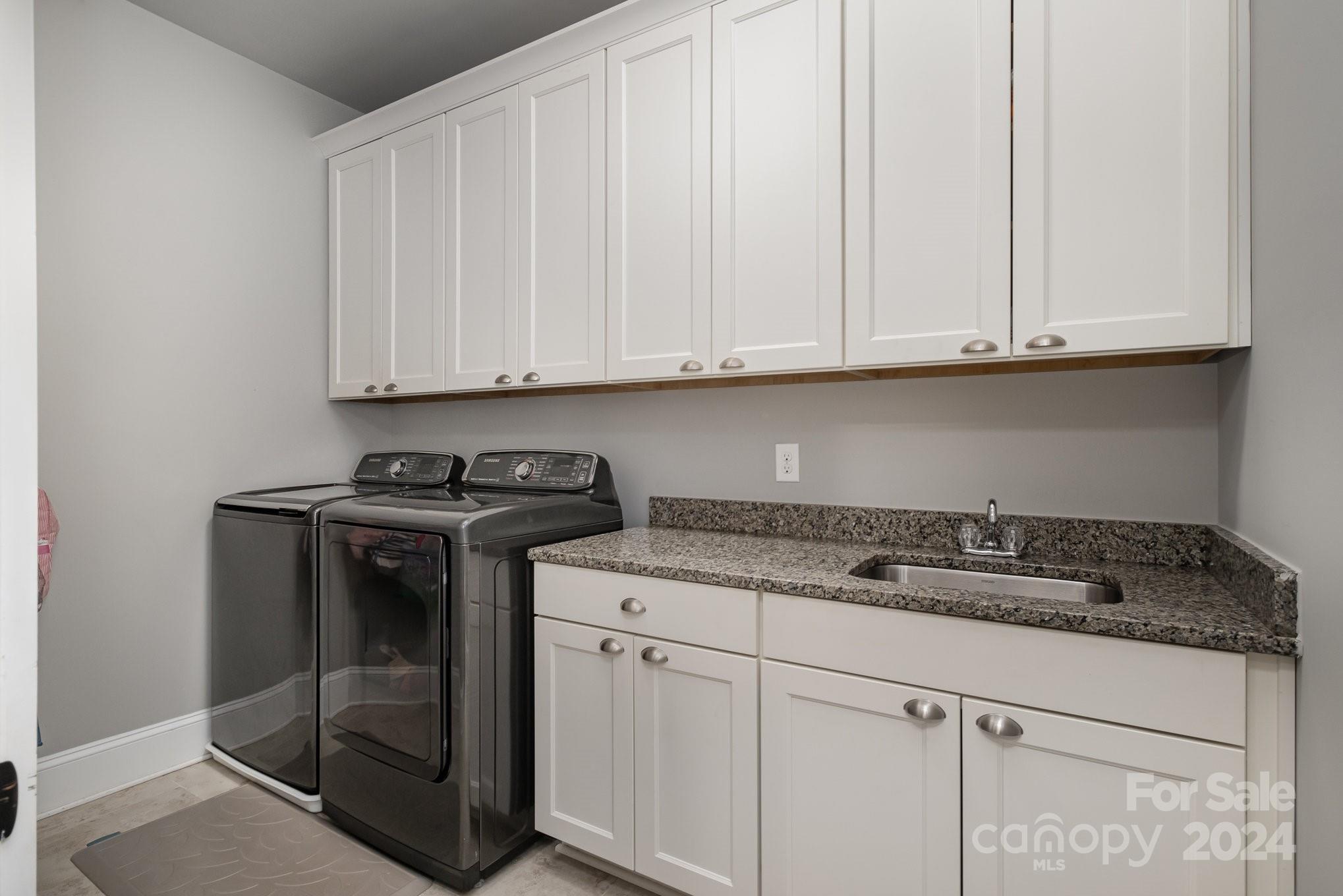 2289 Tatton Hall Road Fort Mill, SC 29715 - Photo 17 of 48 a kitchen with granite countertop white cabinets and sink