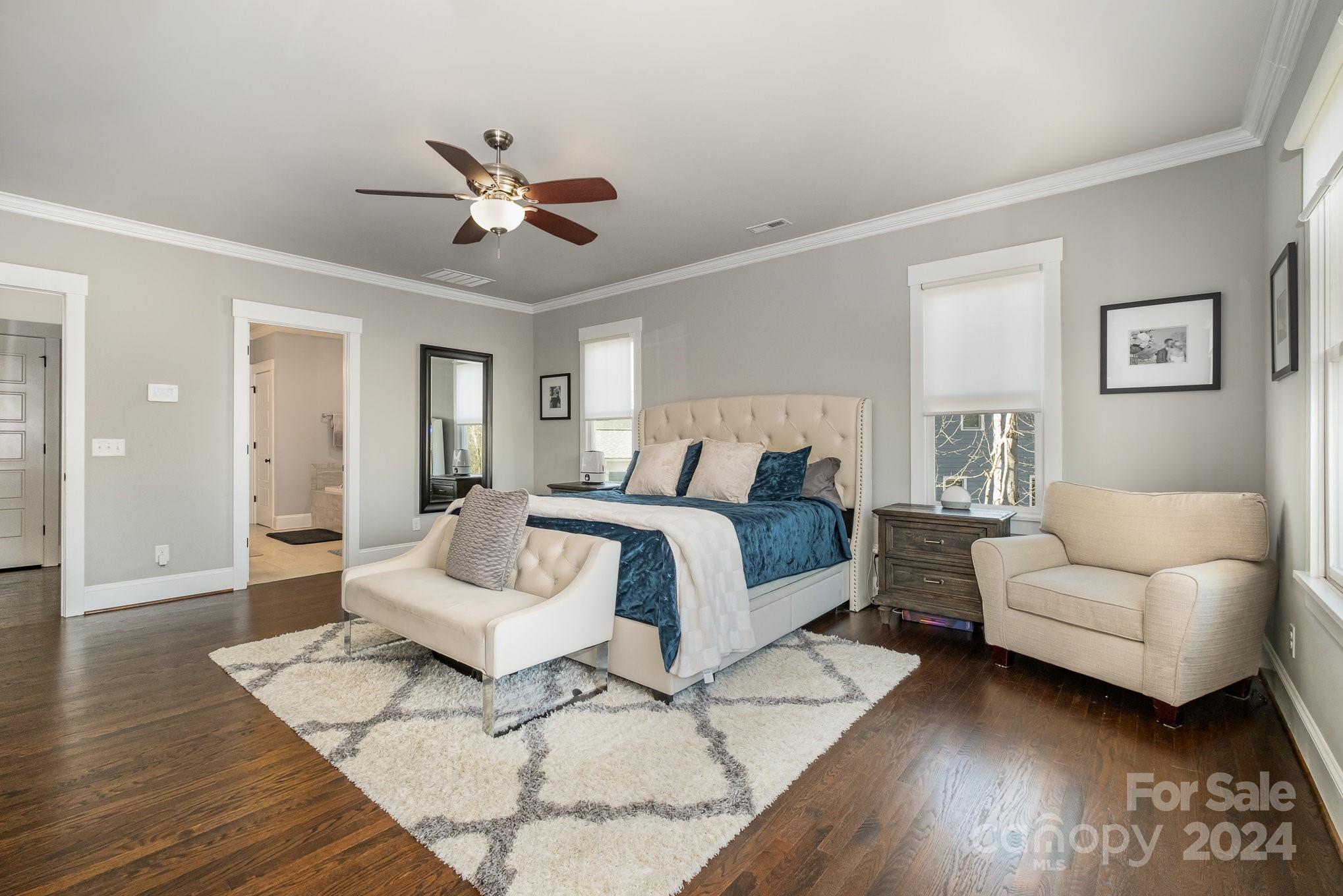 2289 Tatton Hall Road Fort Mill, SC 29715 - Photo 20 of 48 a bedroom with a bed couches and wooden floor