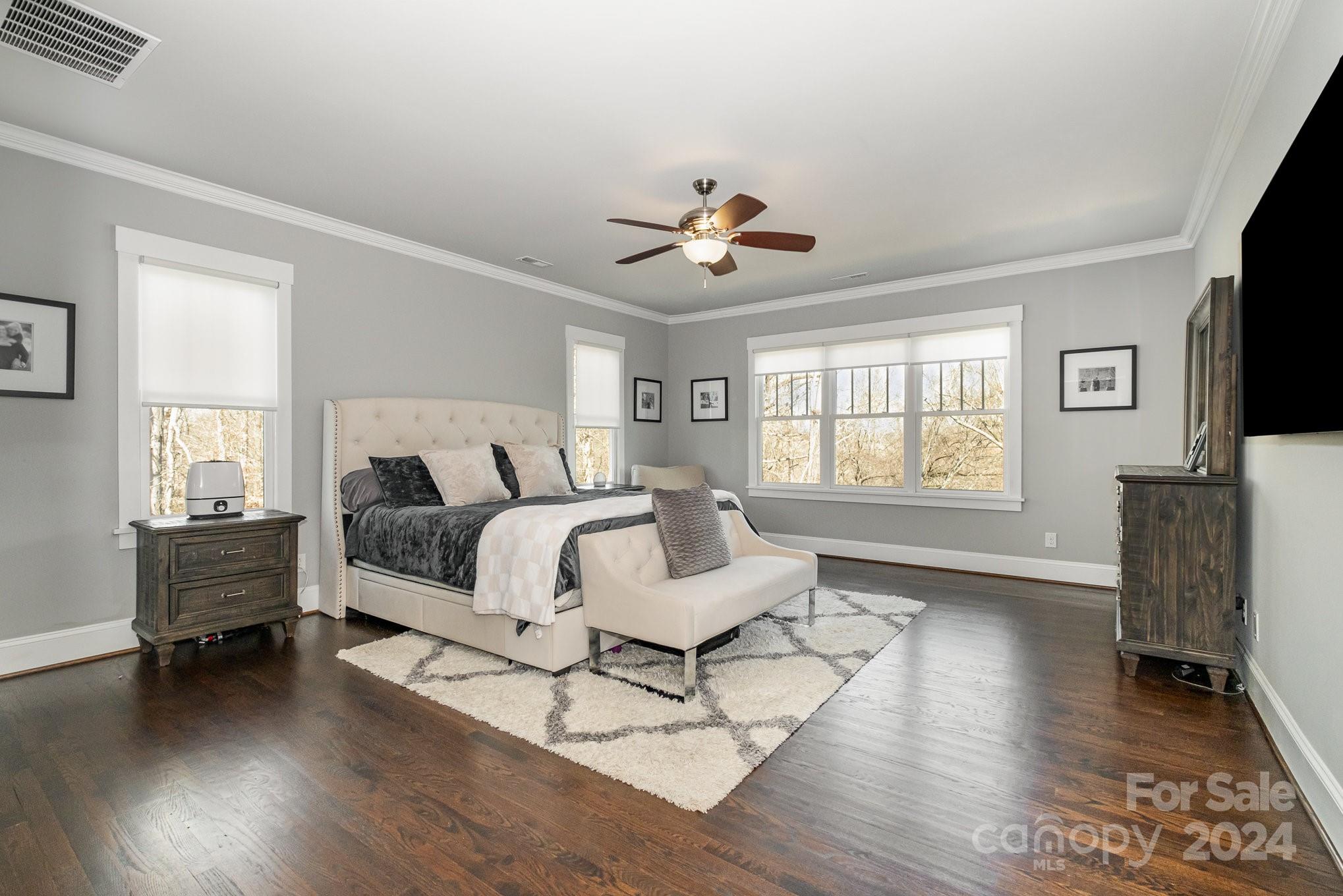 2289 Tatton Hall Road Fort Mill, SC 29715 - Photo 21 of 48 a spacious bedroom with a bed and a flat screen tv