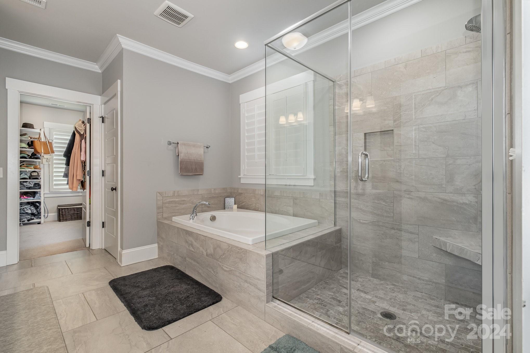 2289 Tatton Hall Road Fort Mill, SC 29715 - Photo 23 of 48 a bath room with a sink a mirror and a shower