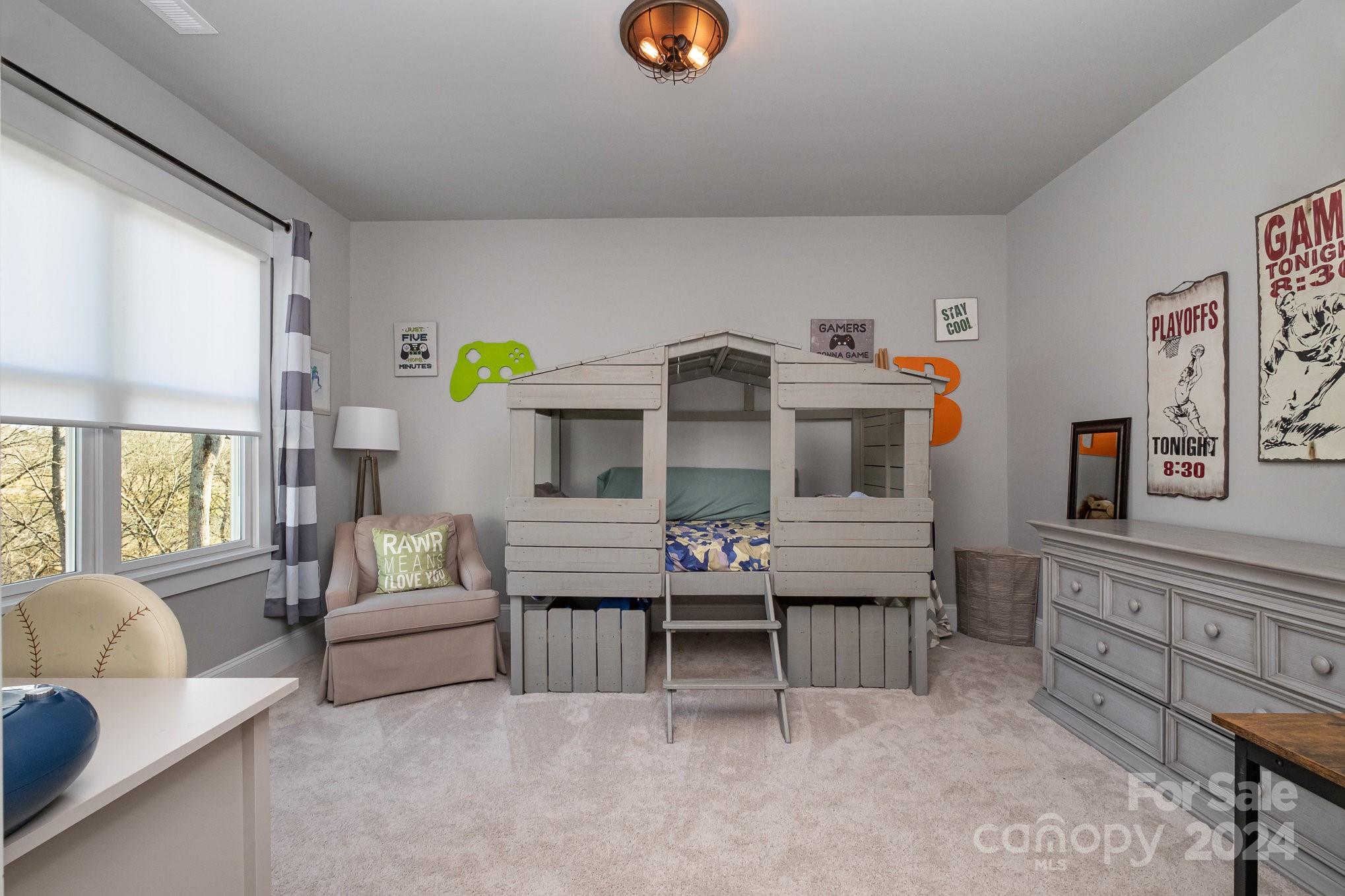 2289 Tatton Hall Road Fort Mill, SC 29715 - Photo 27 of 48 a living room with furniture and a baby crib