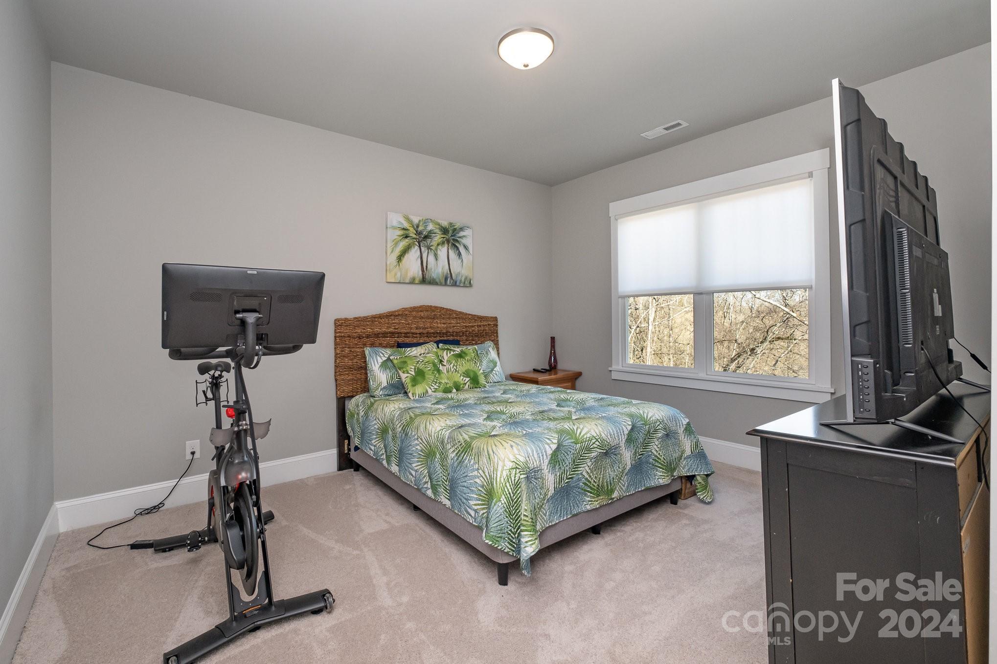 2289 Tatton Hall Road Fort Mill, SC 29715 - Photo 29 of 48 a bedroom with a bed and a table
