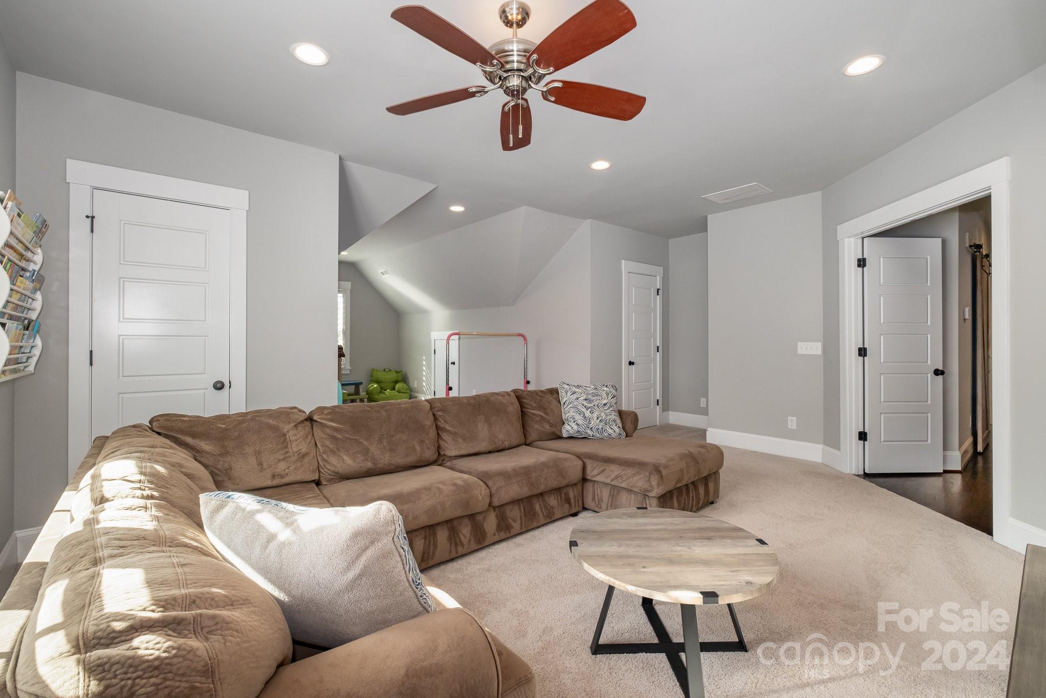 2289 Tatton Hall Road Fort Mill, SC 29715 - Photo 33 of 48 a living room with furniture and a ceiling fan
