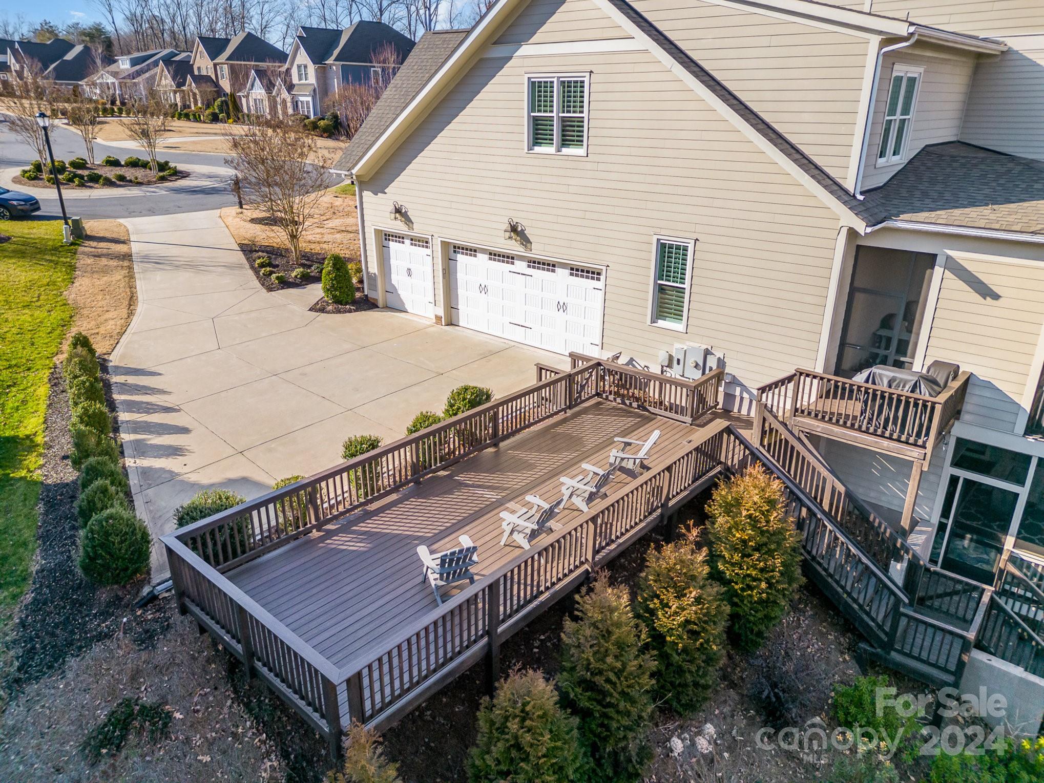 2289 Tatton Hall Road Fort Mill, SC 29715 - Photo 38 of 48 a view of a patio with table and chairs with wooden floor and fence