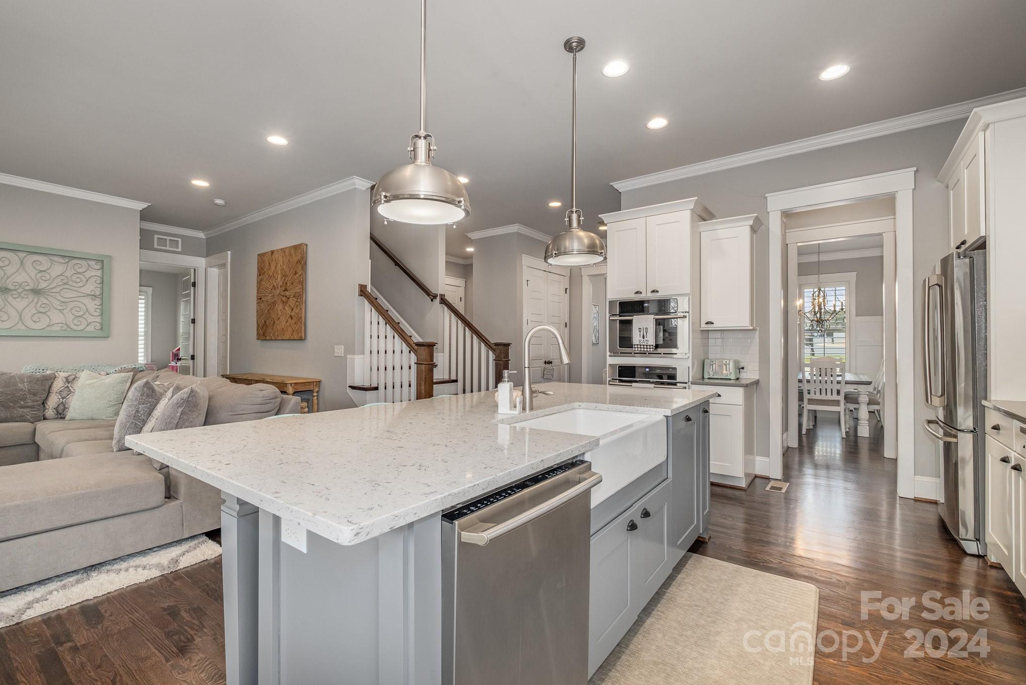 2289 Tatton Hall Road Fort Mill, SC 29715 - Photo 6 of 48 a large kitchen with kitchen island a sink and a stove