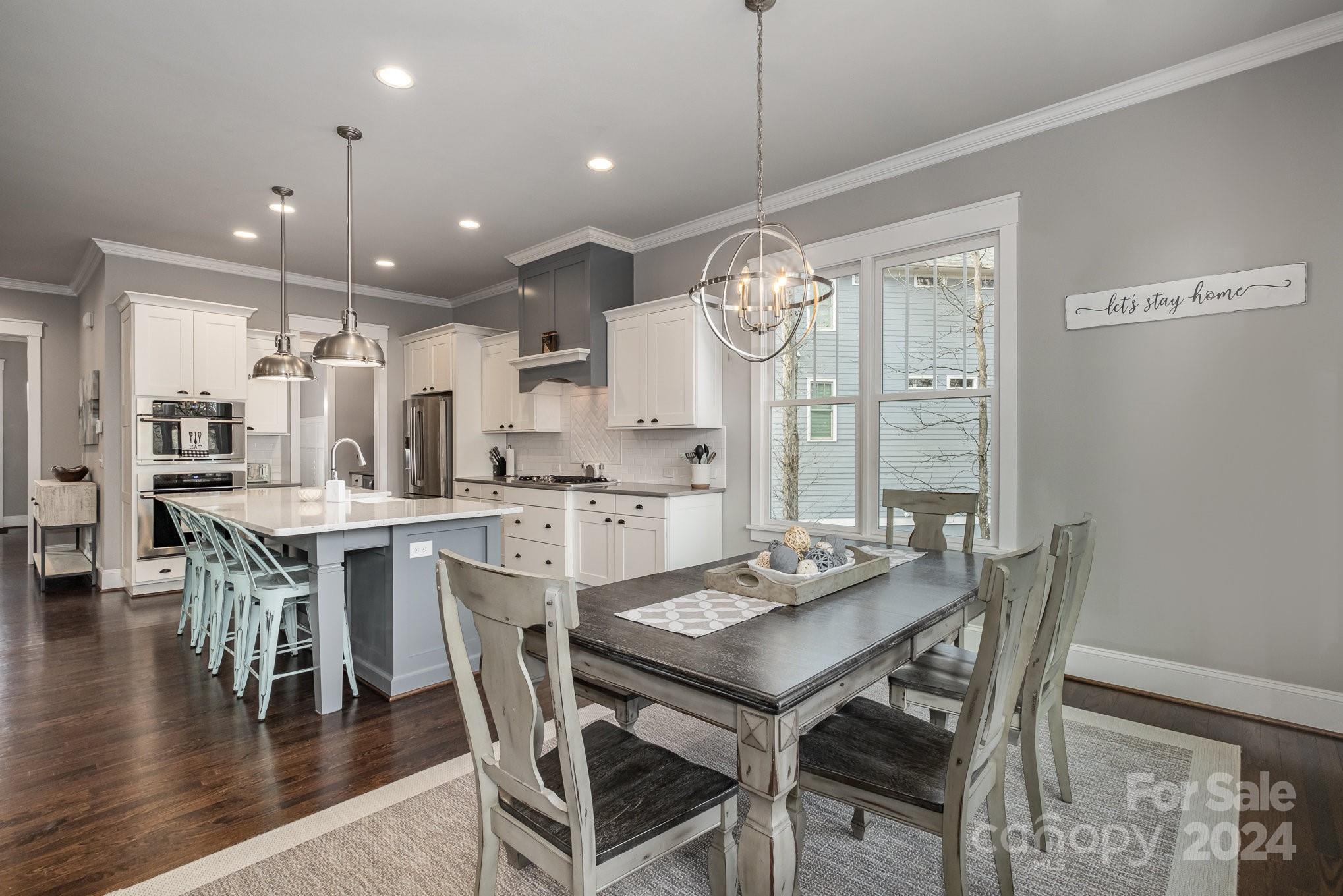 2289 Tatton Hall Road Fort Mill, SC 29715 - Photo 8 of 48 a dining room with stainless steel appliances kitchen island a table and chairs