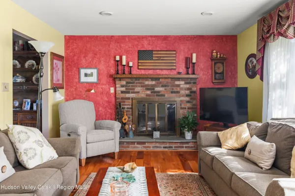 a living room with furniture and a fireplace