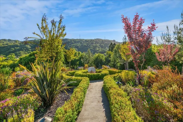 a kitchen with stainless steel appliances granite countertop a stove and a sink