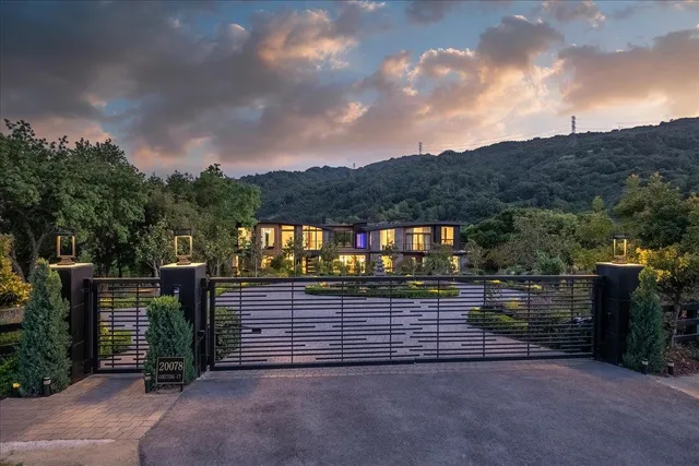 a bedroom with furniture and a large window