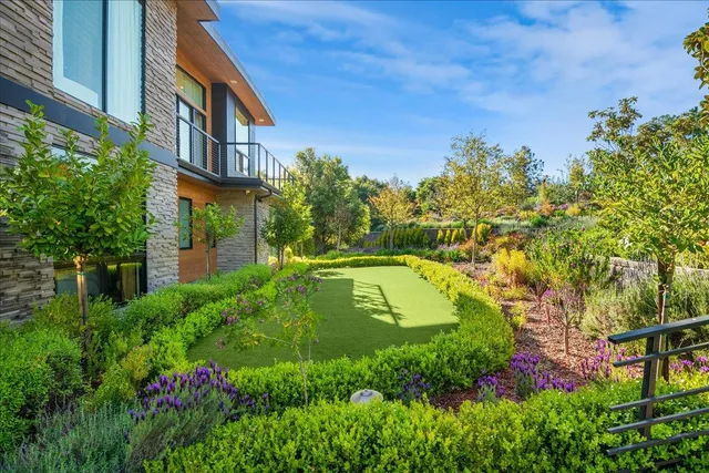 a view of a swimming pool with a garden