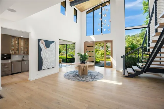 a bathroom with a double vanity sink mirror and shower