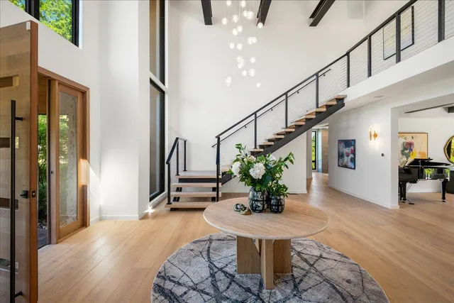 an aerial view of a house with yard swimming pool and outdoor seating
