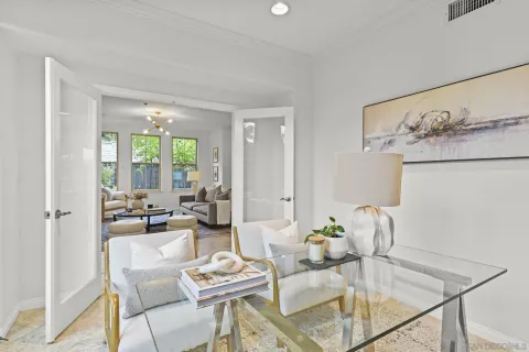 a living room with furniture and wooden floor
