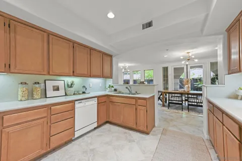 a kitchen with sink cabinets and window