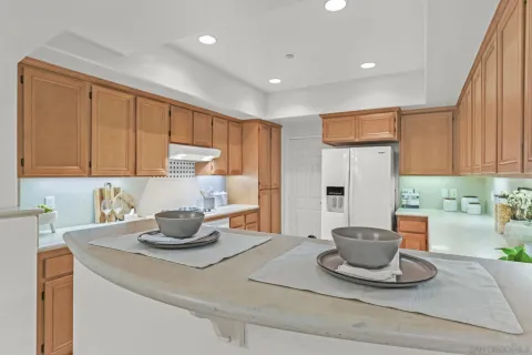 a kitchen with a stove a sink and a cabinets