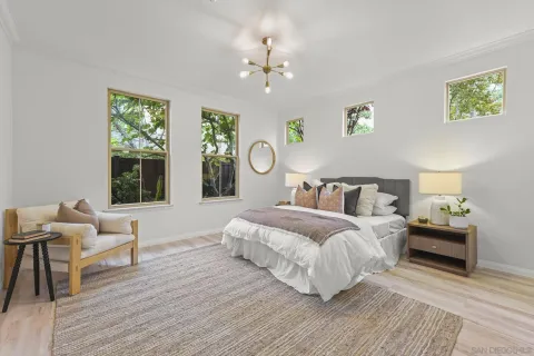 a spacious bedroom with a bed and window