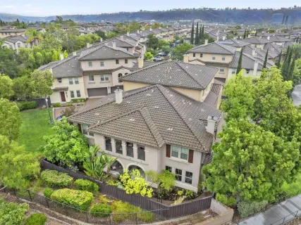 an aerial view of a house with a garden