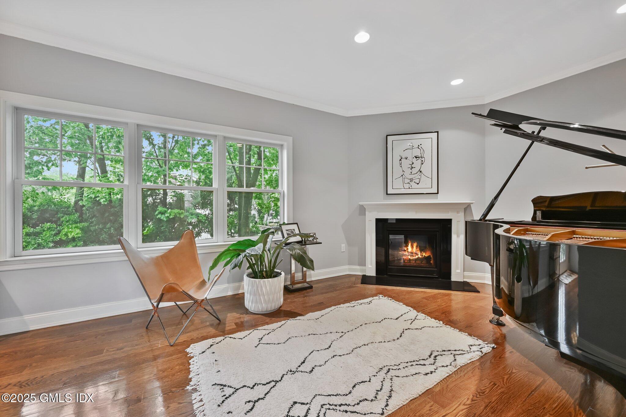 8 View Street, Unit 10 Greenwich, CT 06830 - Photo 13 of 26 a living room with furniture a window and a fireplace
