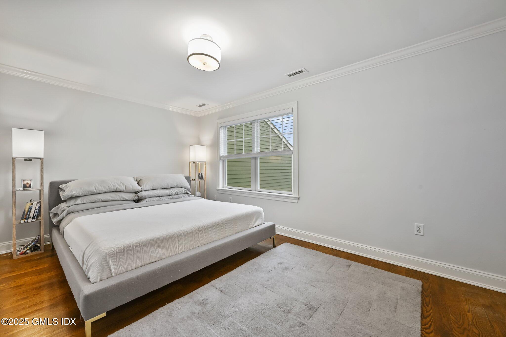 8 View Street, Unit 10 Greenwich, CT 06830 - Photo 14 of 26 a bedroom with a bed and a window