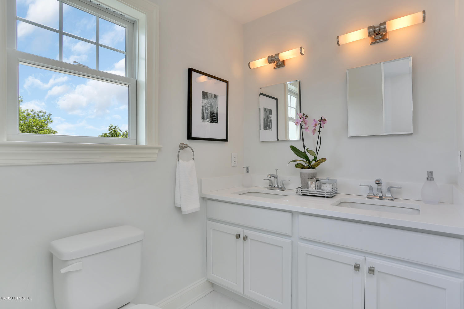 8 View Street, Unit 10 Greenwich, CT 06830 - Photo 16 of 26 a bathroom with a sink a vanity and a mirror