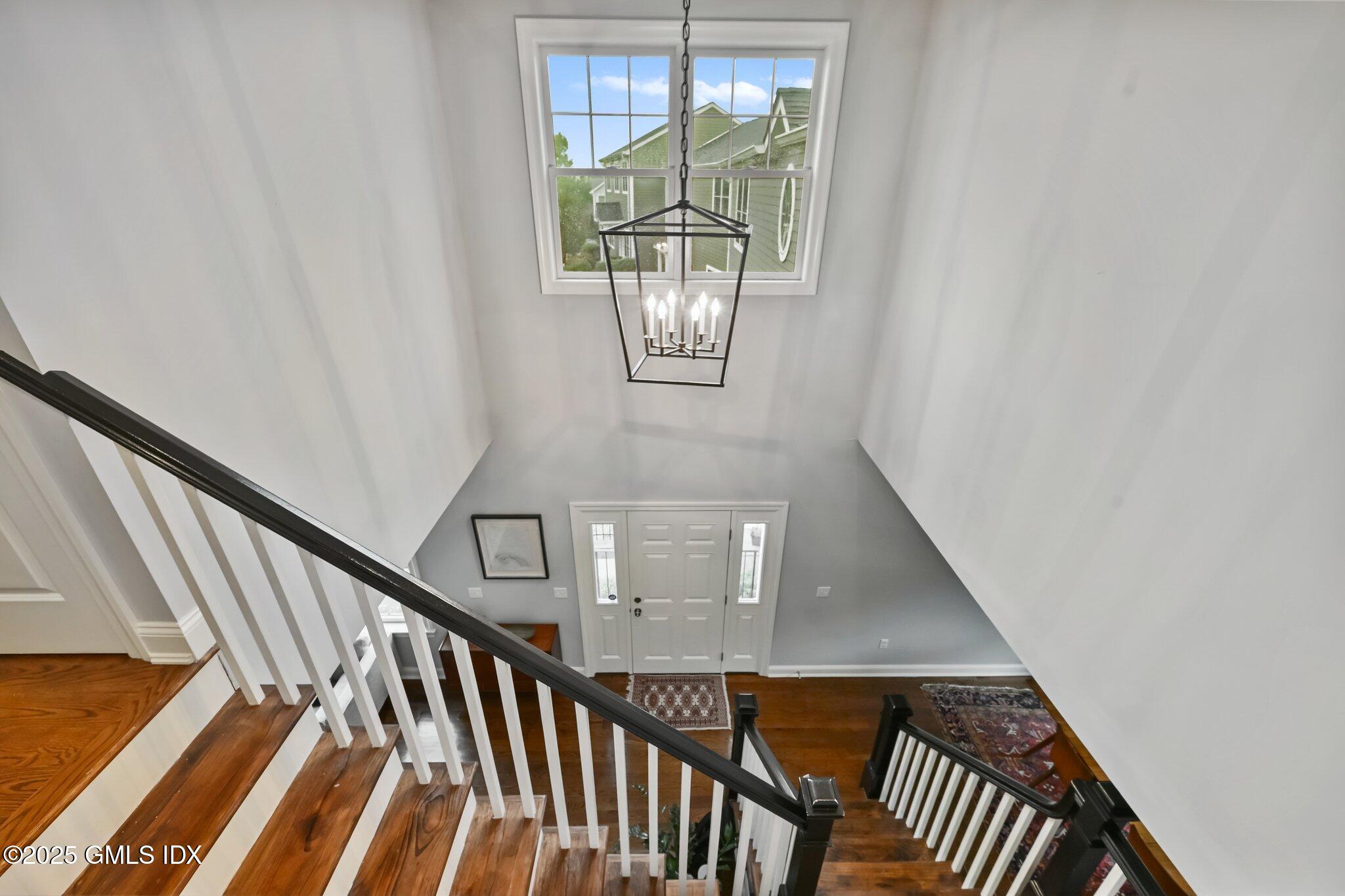 8 View Street, Unit 10 Greenwich, CT 06830 - Photo 2 of 26 a view of staircase with railing and white walls