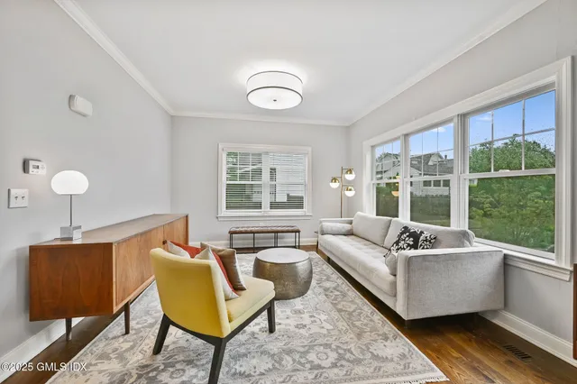 a living room with furniture and a window